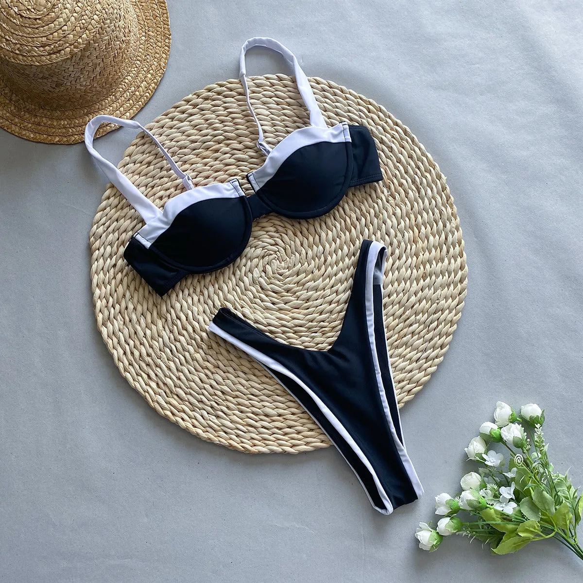 Black women's nylon bikini briefs set on a mannequin, showing front and back.