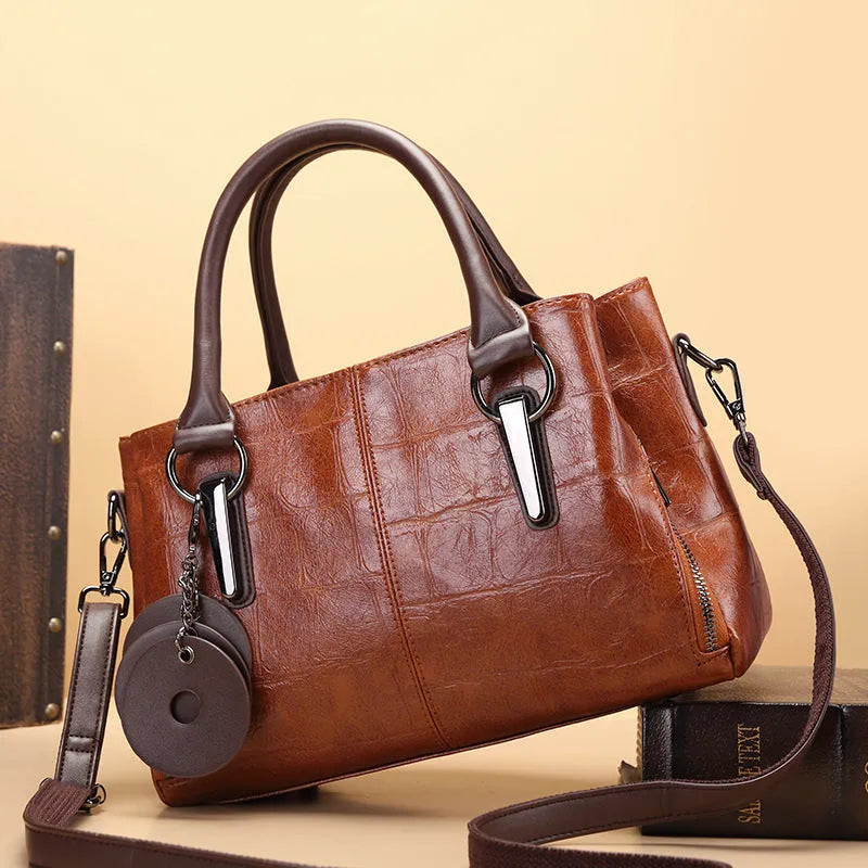 Large capacity shoulder bag with urban simplicity style, showing internal zipper compartments and contrasting sewing thread details
