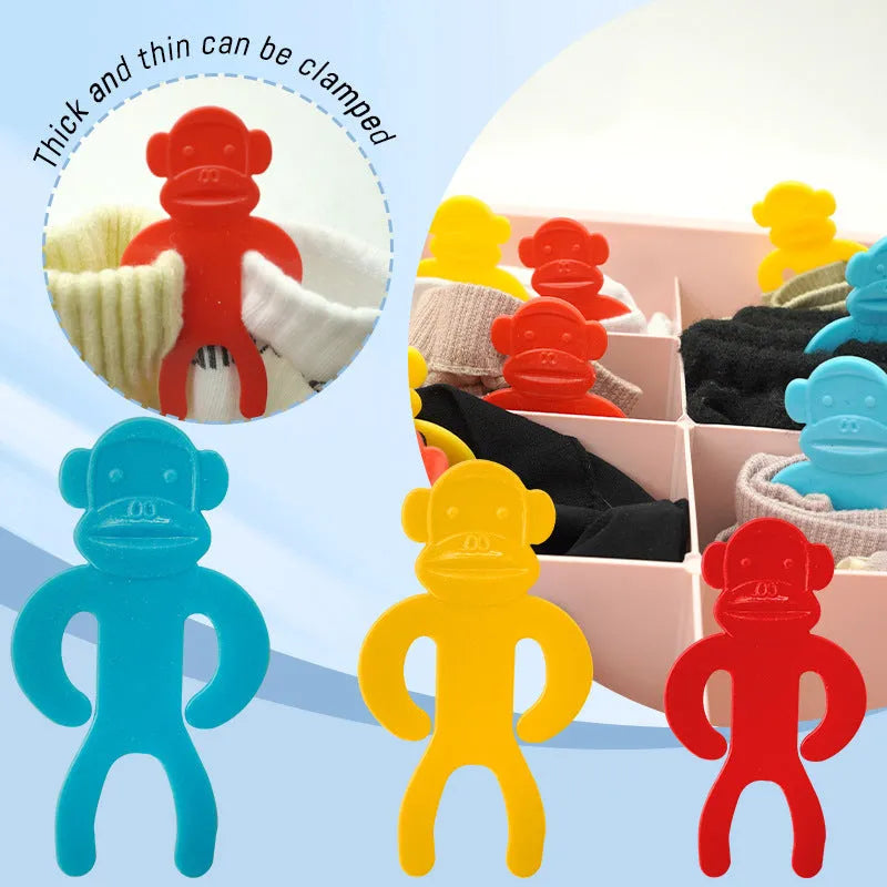 Plastic socks clips in blue, red, and yellow colours for organising laundry