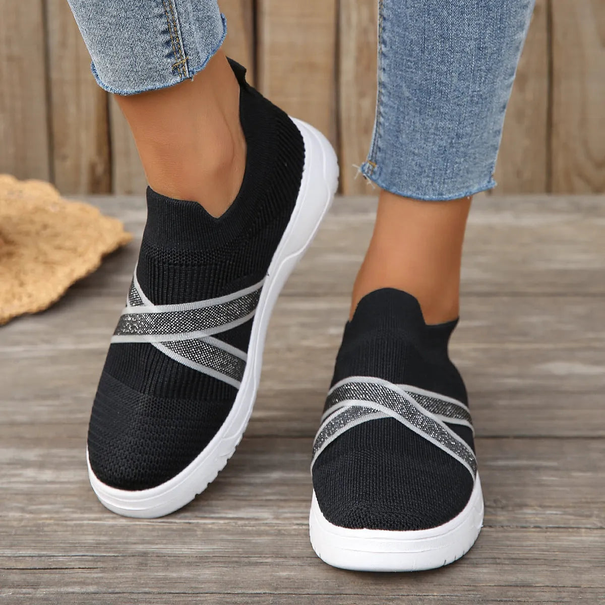 Women's black flyknit mesh casual shoes with flat rubber sole and tassel detail