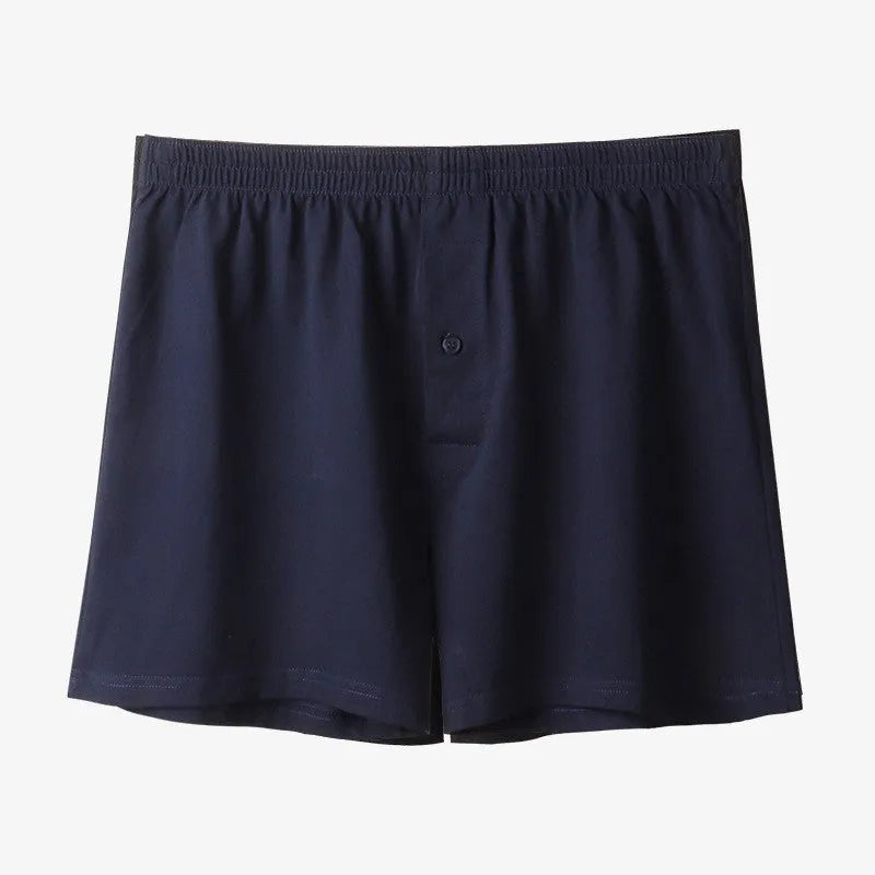 Men's high-waist cotton boxer shorts in light grey, navy blue, and black colours showing knitted fabric texture