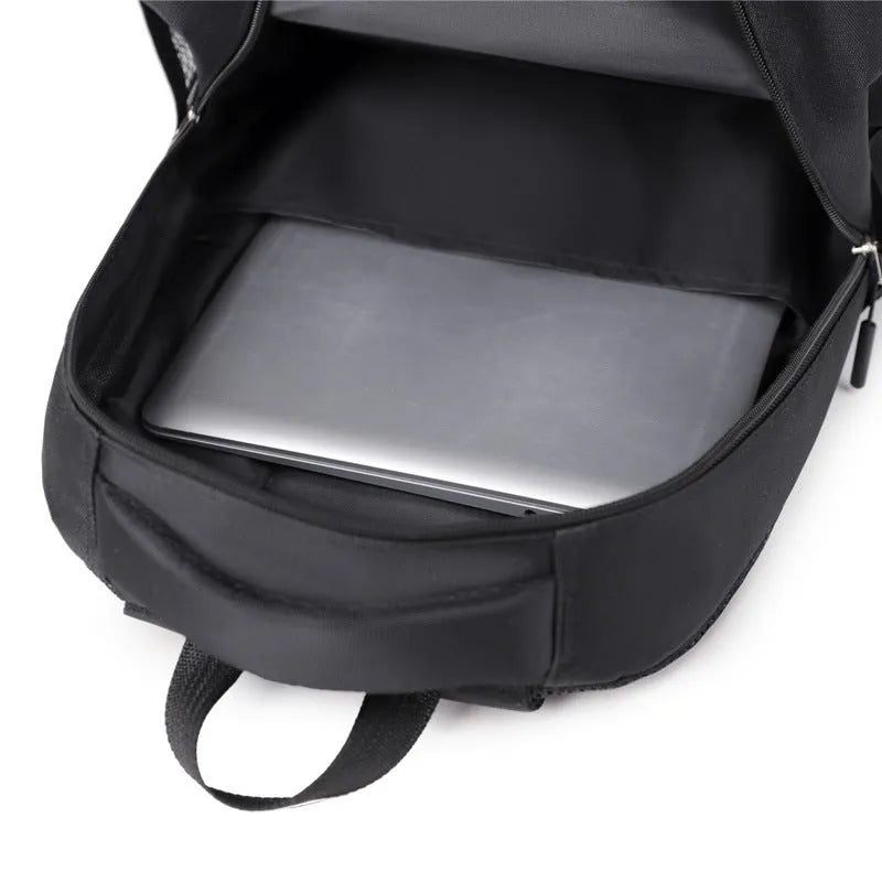 Casual Oxford cloth men's backpack in grey, shown from a side angle.