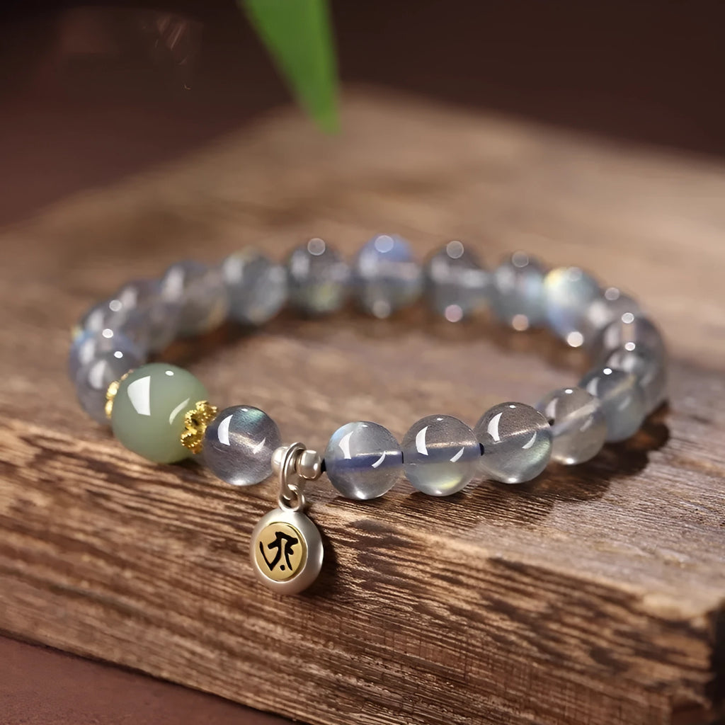 Women's bracelet with 8mm moonstone bead and electroplated Thousand-Hand Kwan-yin mouse charm.