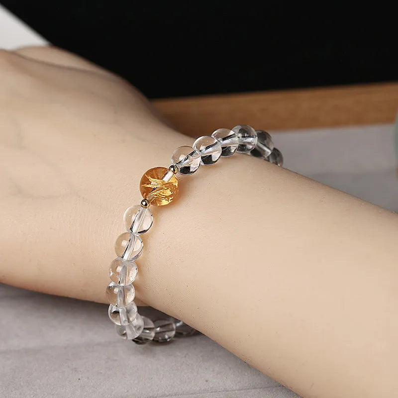 Unisex geometric obsidian and white crystal bracelet with black agate beads and golden dragon accent