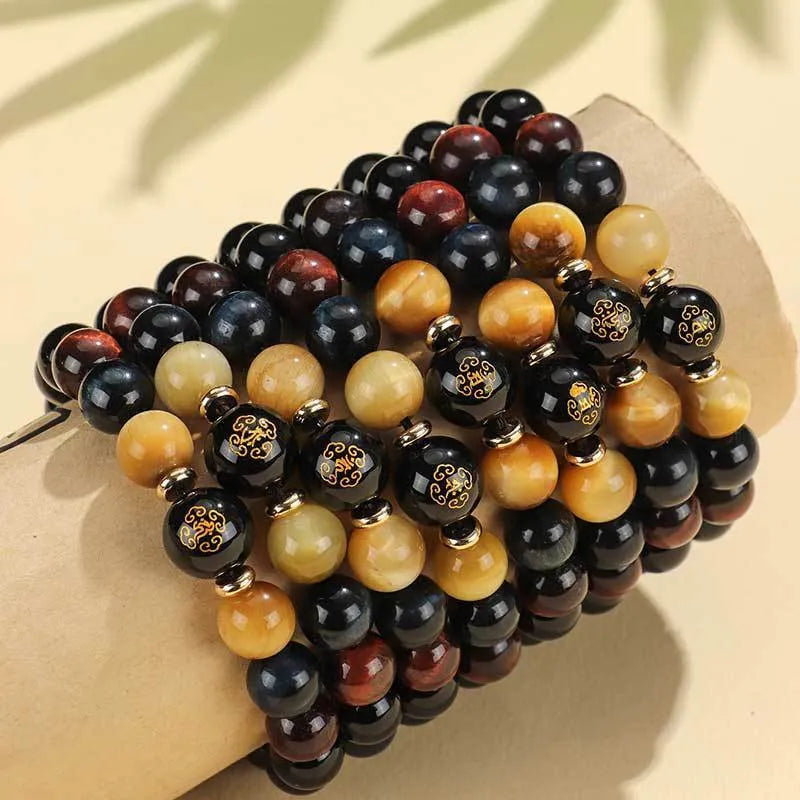 Handmade black agate beaded bracelet with tiger eye stones and Buddhist deity zodiac charms