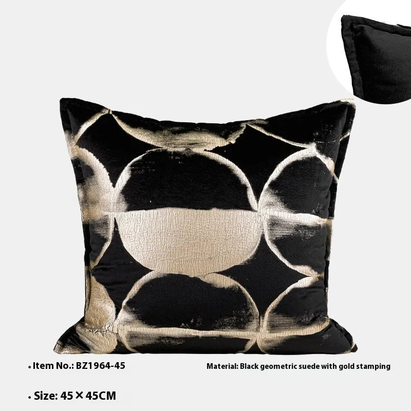 Black gold abstract pattern cushion with removable cover in three size options on furniture