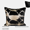 Black gold abstract pattern cushion with removable cover in three size options on furniture
