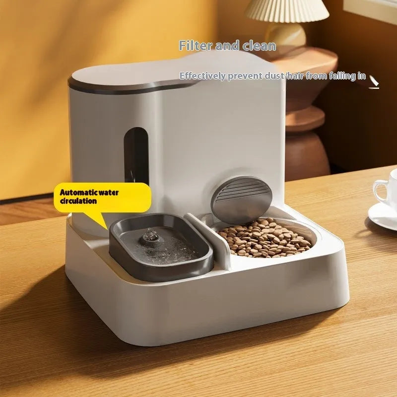 Gray automatic cat feeder with double bowl system showing food and water compartments