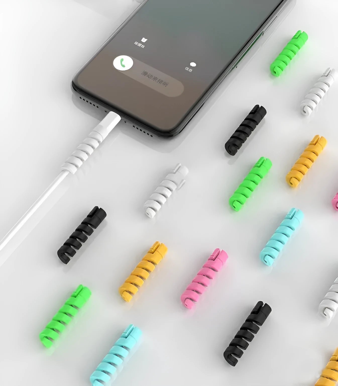 Plastic charging cable protector in assorted colours, measuring 3.5cm long.