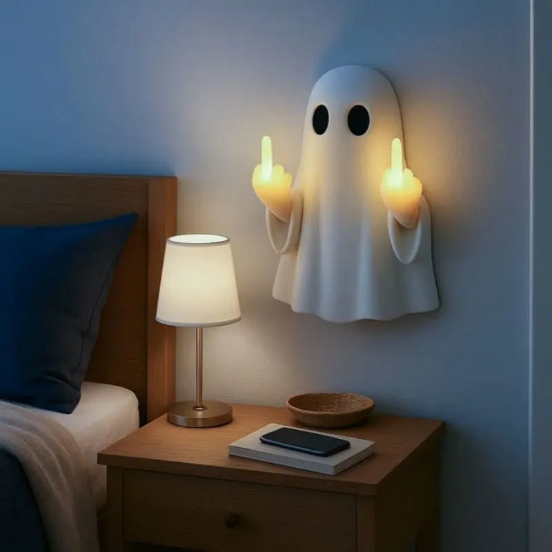 White ghost-shaped night lamp on table with soft glow, measuring 19.85cm tall for Halloween decor