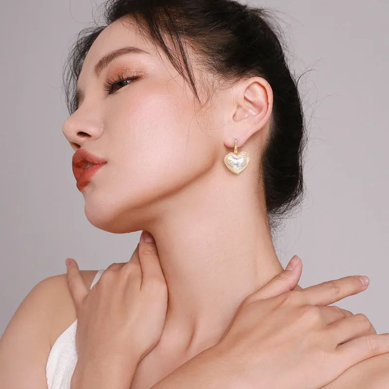 Gold coloured summer love design alloy ear clips for women.