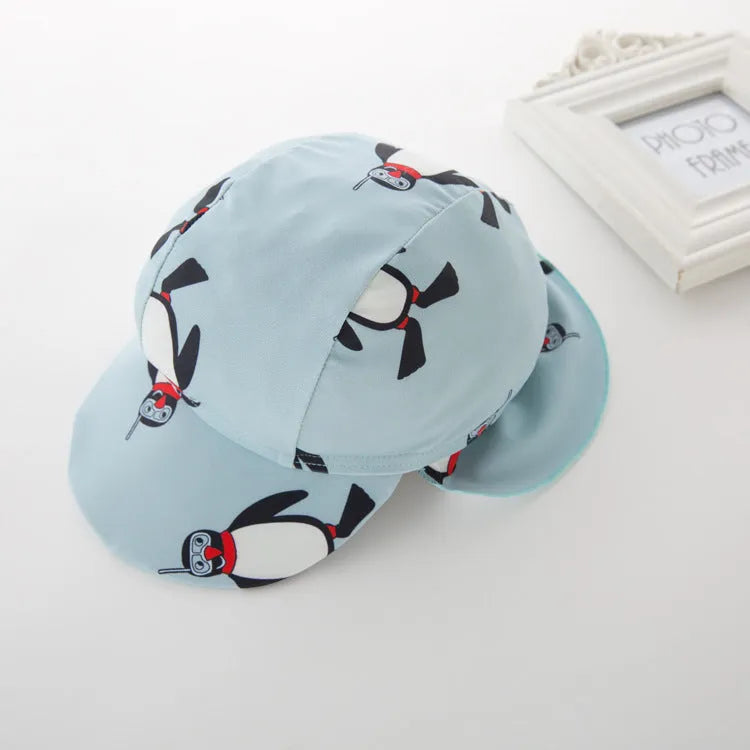 Boy's penguin print long sleeve swimsuit with matching swimming cap for beach sun protection