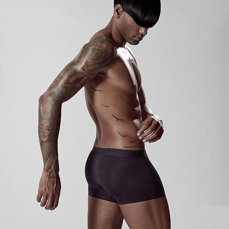 Men's seamless modal underwear in green colour showing mid-waist design and body shaping features