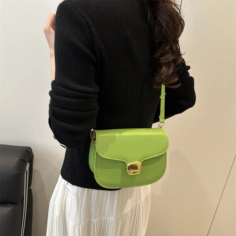 Women's PU leather handbag showing internal zipper pocket and phone compartment in available colours
