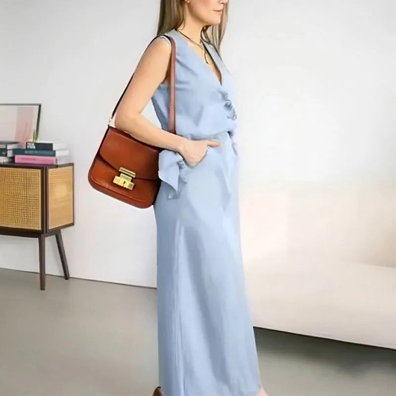 Casual loose top long skirt two-piece suit in blue, featuring a sleeveless vest and long skirt made from polyester fabric.