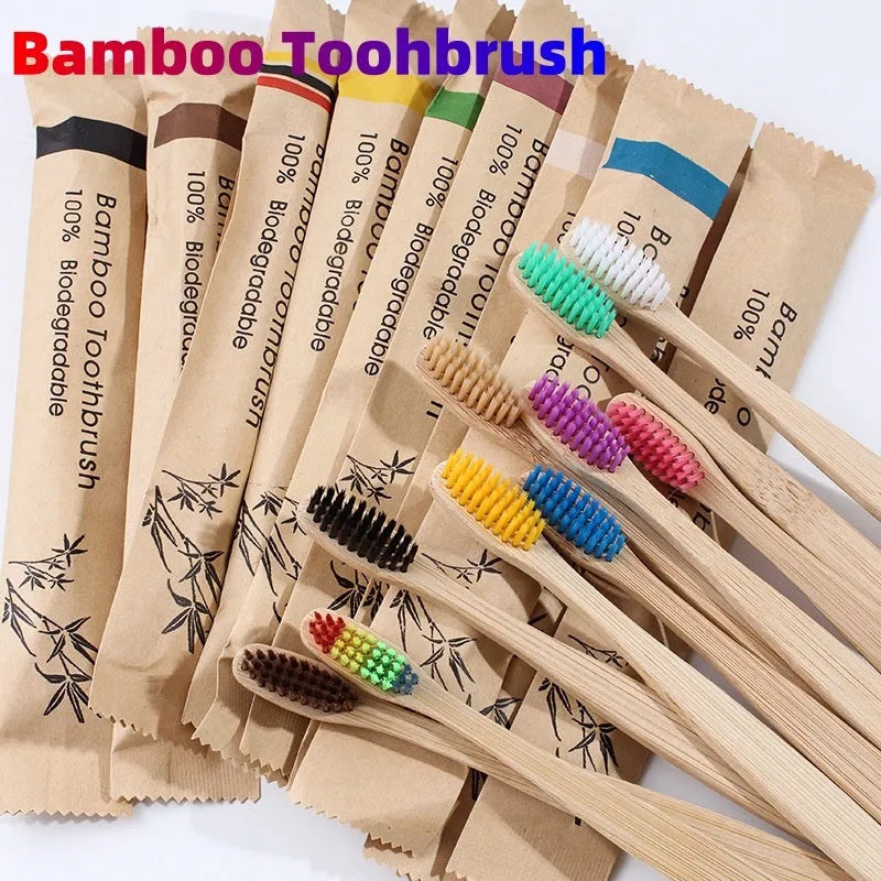 Set of 10 bamboo toothbrushes with charcoal bristles in various colours showing 17.5cm handles