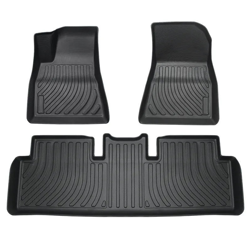 Rubber floor mats for Tesla cars with TPE footrest, custom-fit to Model 3, Y, S, X interiors, showing non-slip backing and textured surface