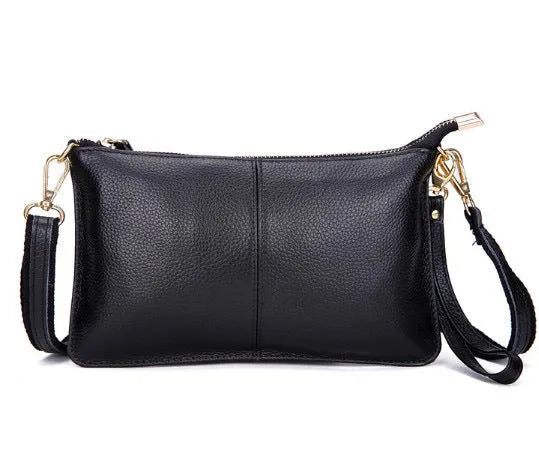 Lady cowhide slant bag showing compact dimensions and multiple compartments for organisation