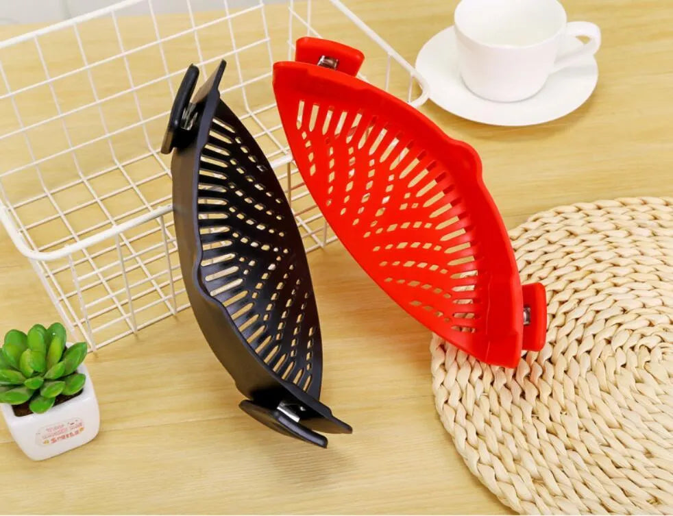 Silicone clip-on kitchen strainer with stainless steel mesh attached to pot rim for draining liquids