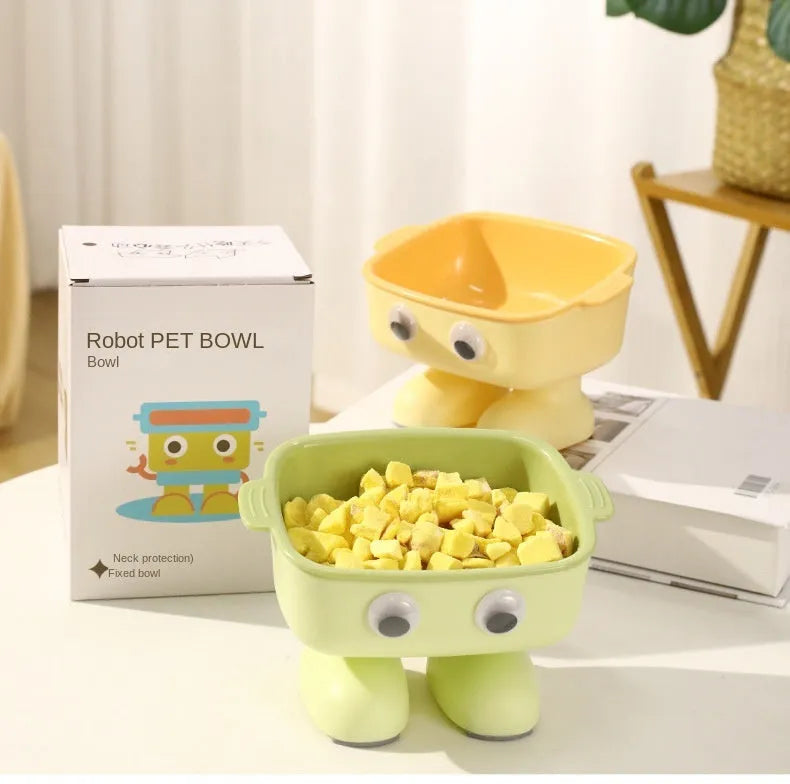 Green robot-shaped elevated cat bowl with tilted design and detachable inner food container