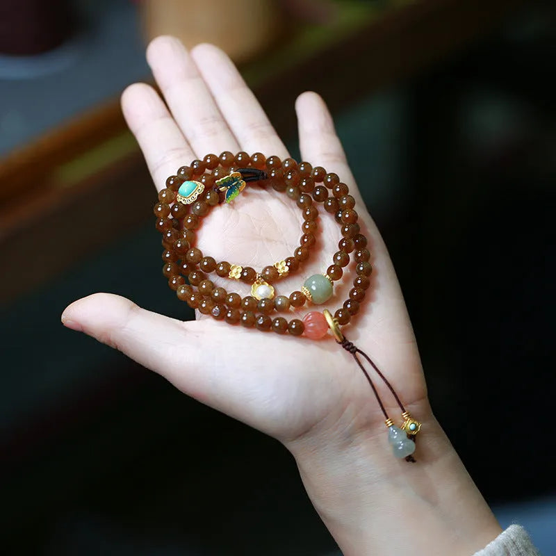 Brown Hetian jade three-ring bracelet with geometric design, butterfly motifs and silver accessories