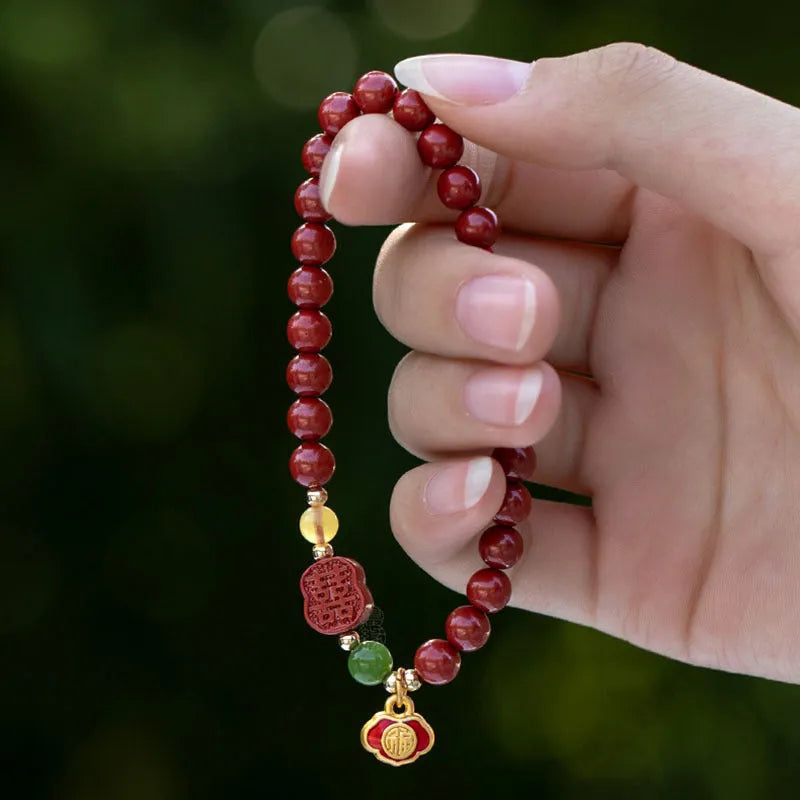 Handcrafted cinnabar bracelet with emperor sandstone beads and traditional fu character design in New Chinese style
