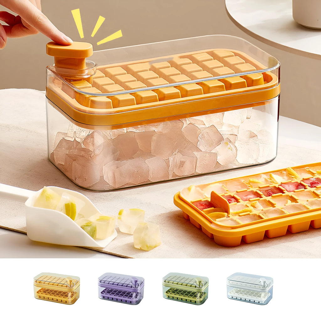 Green one-button press ice cube mould with transparent lid and ice shovel on a kitchen counter