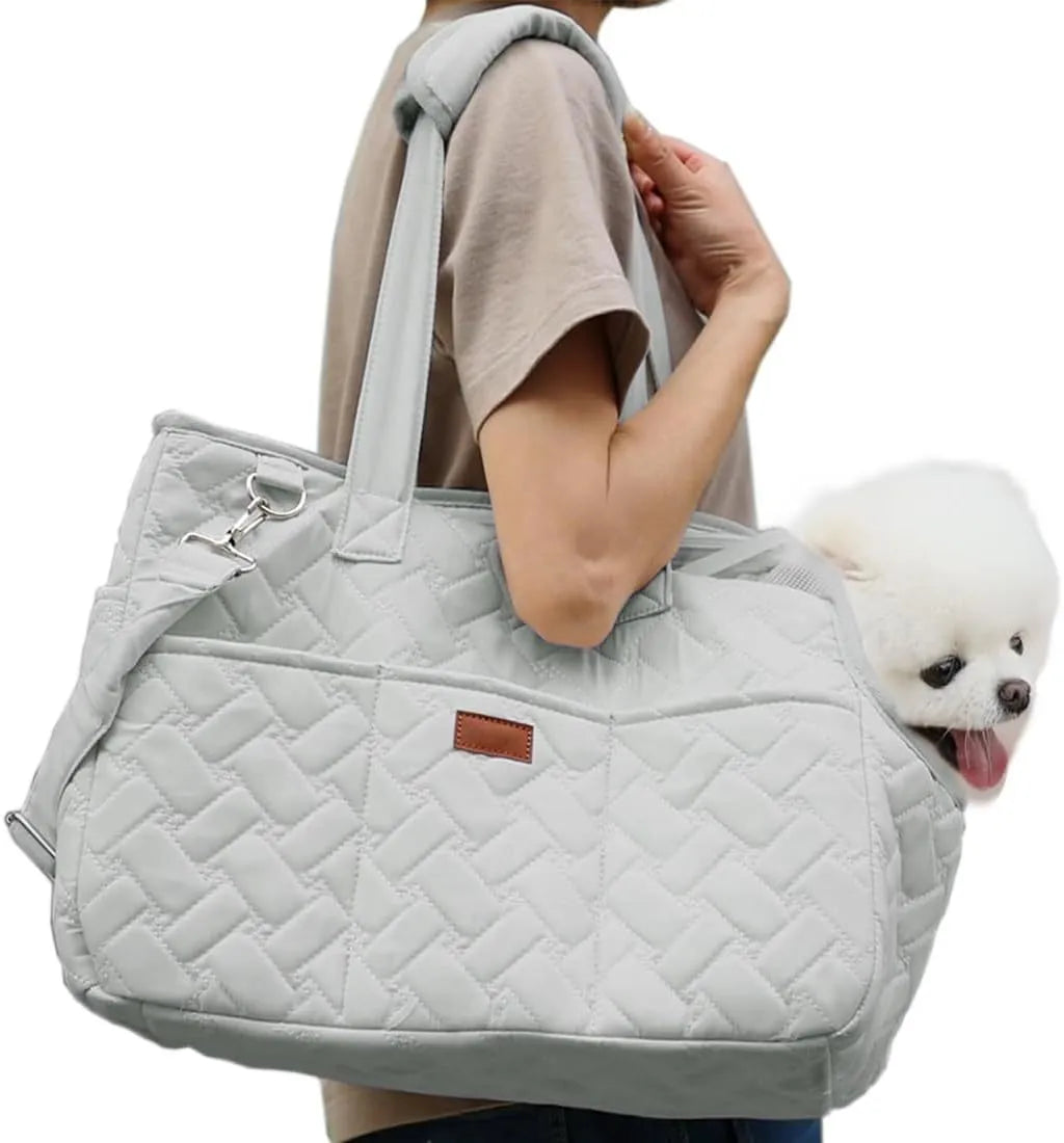 Grey pet carrier handbag with mesh panels showing cat inside, multiple pockets visible on exterior