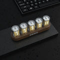 RGB LED digital tube clock showing colourful time display on a desk.