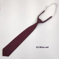 Navy blue solid colour cotton men's tie with arrow style design on a white background.