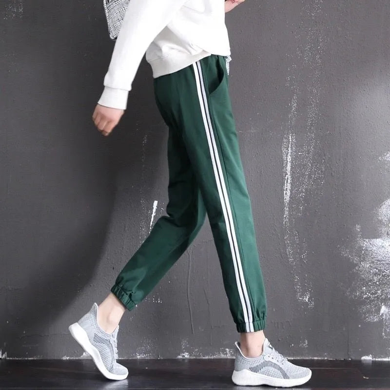 Women's cropped harem track pants in thin polyester, mid waist, solid colour, sizes S to 3XL