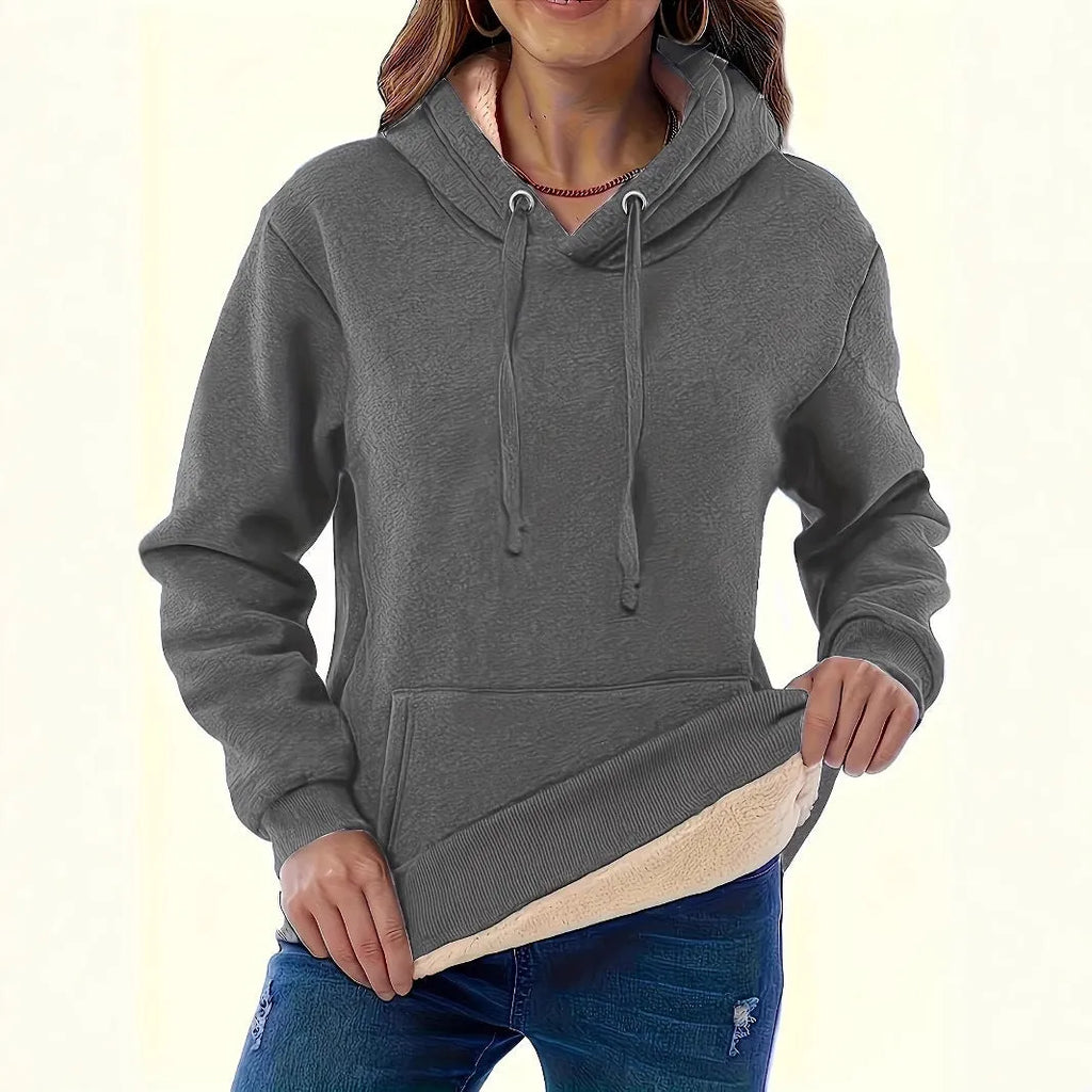 Women's black hooded sweater with a textured 3D pattern, loose fit, and front pockets.