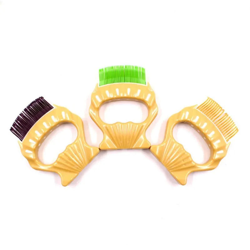 Shell-shaped pet grooming brush in green, orange, or purple with bent wire bristles and anti-slip handle