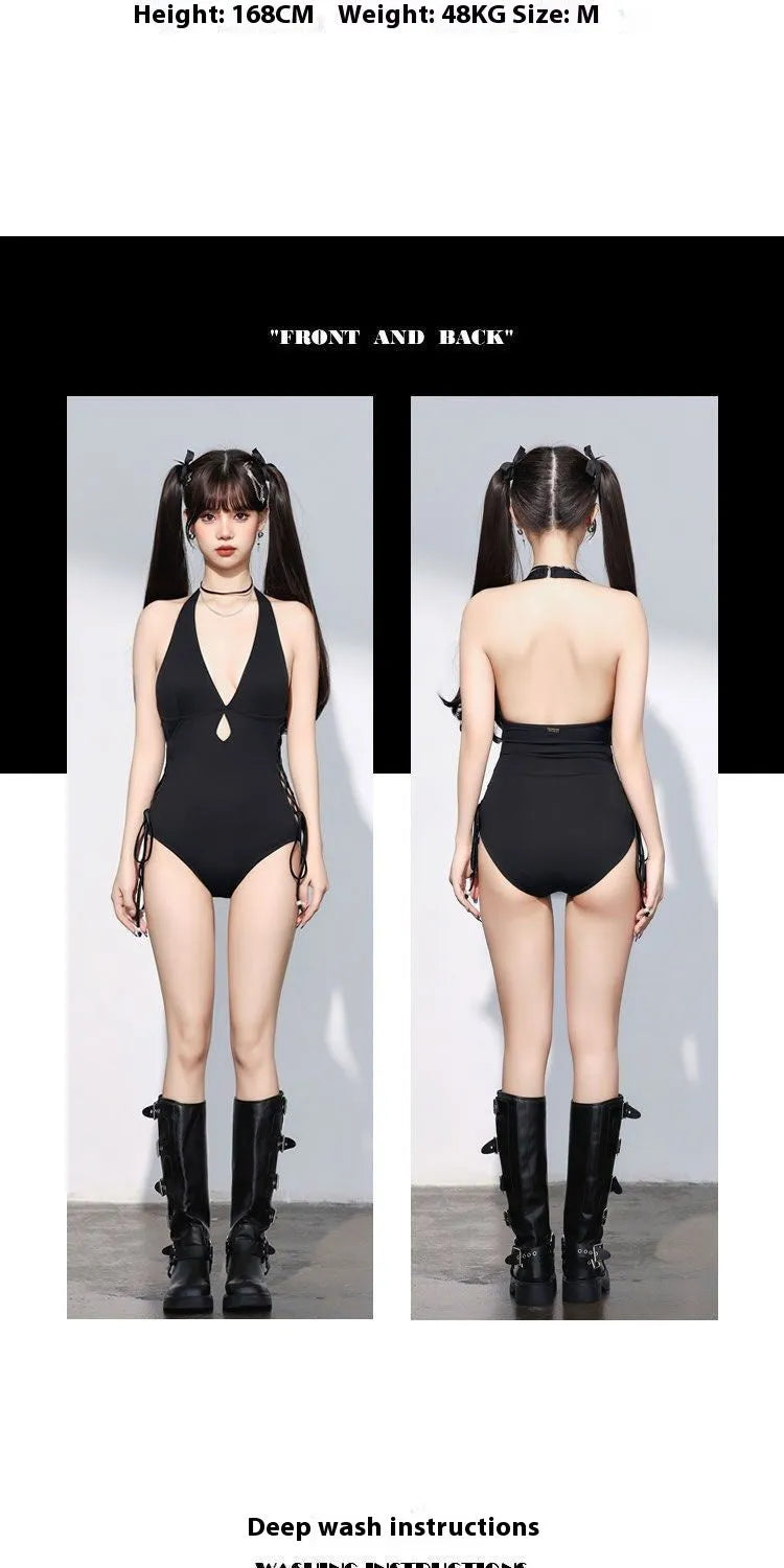 Black women's one-piece swimsuit with V-neck and hollow strap design on a mannequin