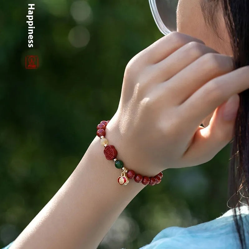 Handcrafted cinnabar bracelet with emperor sandstone beads and traditional fu character design in New Chinese style