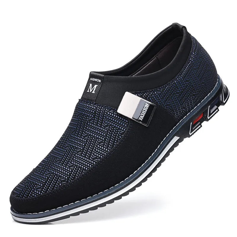 Men's grey and white square toe casual shoes with a low-top synthetic leather upper and flat rubber sole.