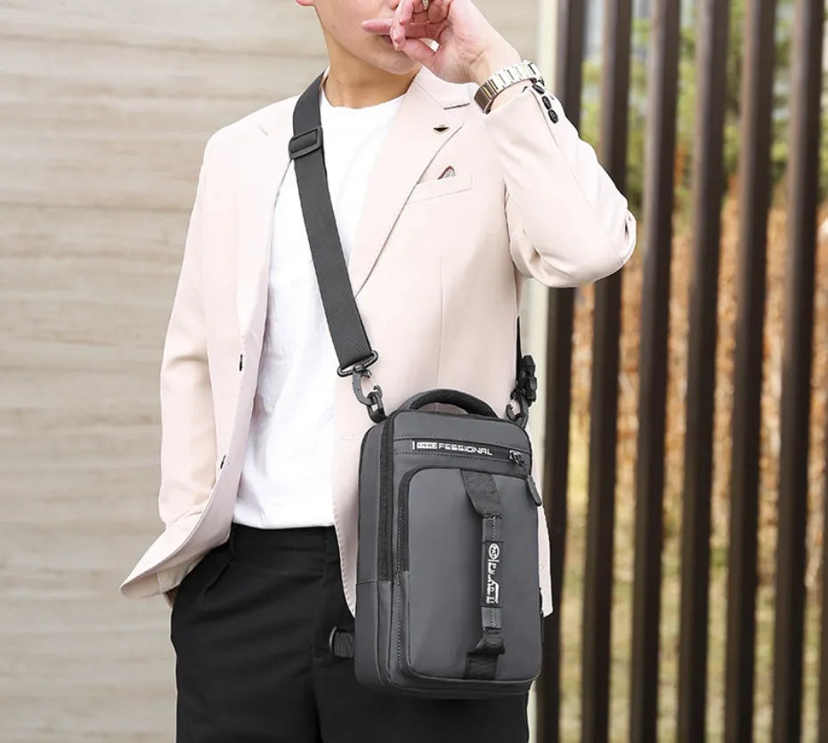 Oxford cloth chest bag in khaki with zip opening, internal zipper pocket, soft handle, and square vertical section shape