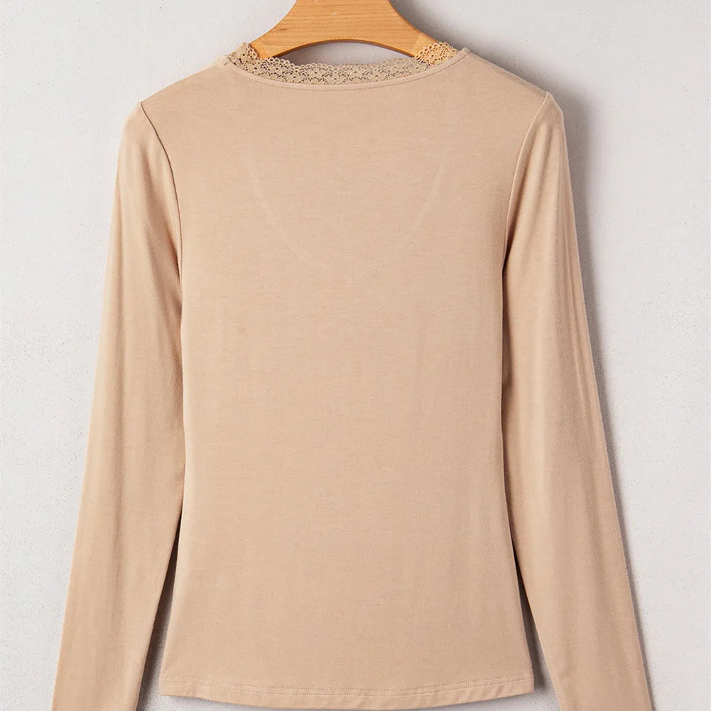 Red women's slim fit long sleeve casual top with lace trim detail on a hanger.