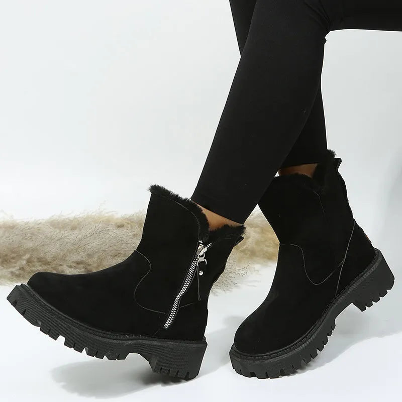 Women's black snow boots with high-top design, side zipper, and non-slip rubber sole for winter