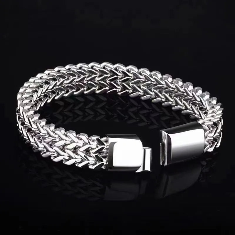Silver titanium steel men's hip hop bracelet with geometric beads on a wrist.