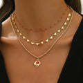 Geometric three-layer heart pendant on an adjustable zinc alloy clavicle chain necklace.