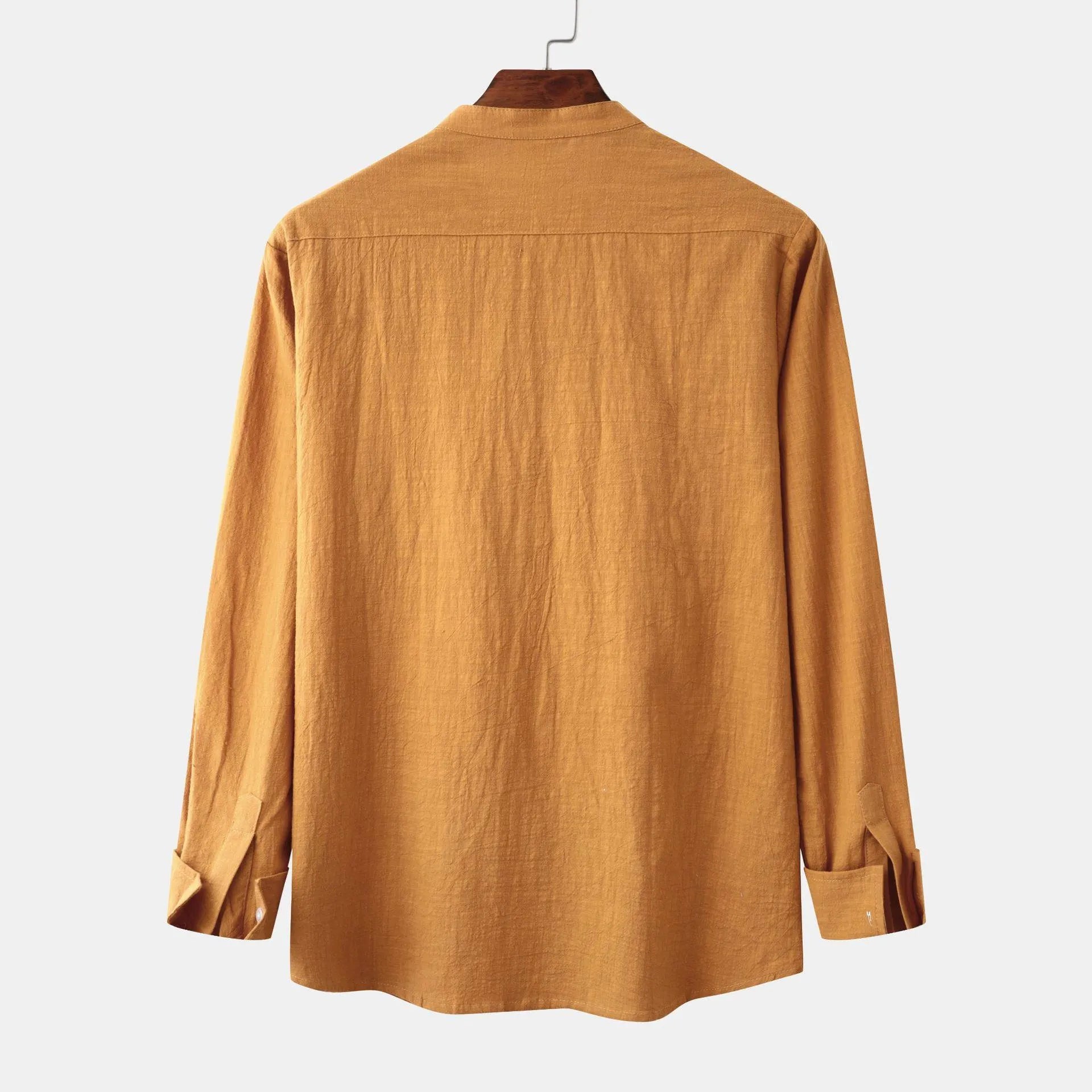 Men's slim fit brown long sleeve shirt and casual pants on a hanger