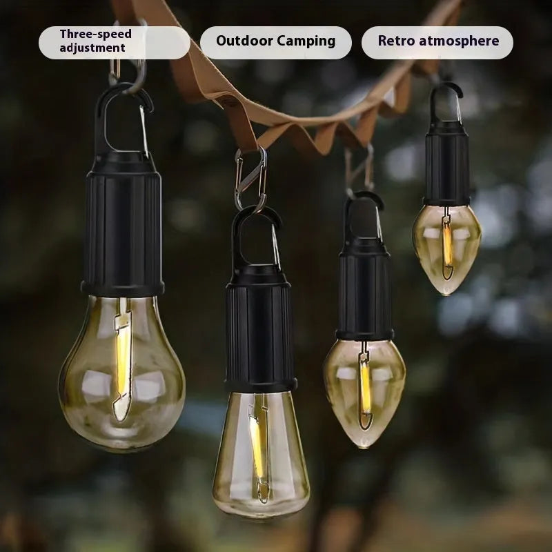 Five solar-powered outdoor lantern-style light bulbs with warm LED illumination