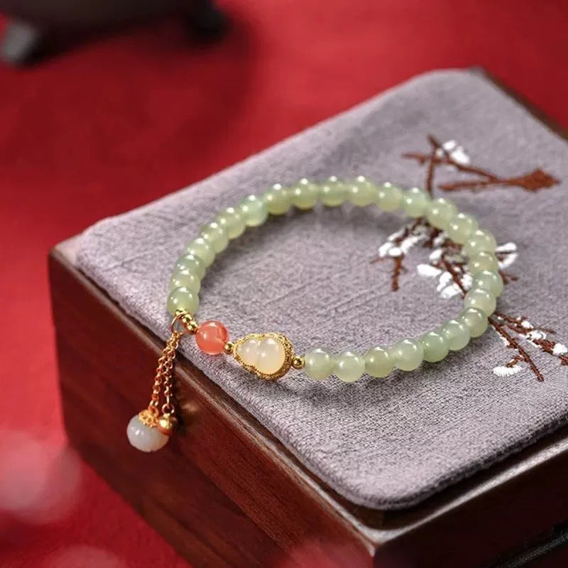 Qingshui jade women's bracelet with fu character and gold gourd motif, 6mm gold plated beads