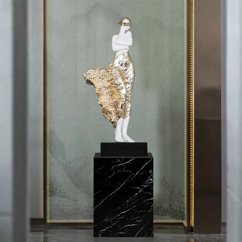 48cm tall sculptured character ornament in natural resin with rose gold finish on wooden surface
