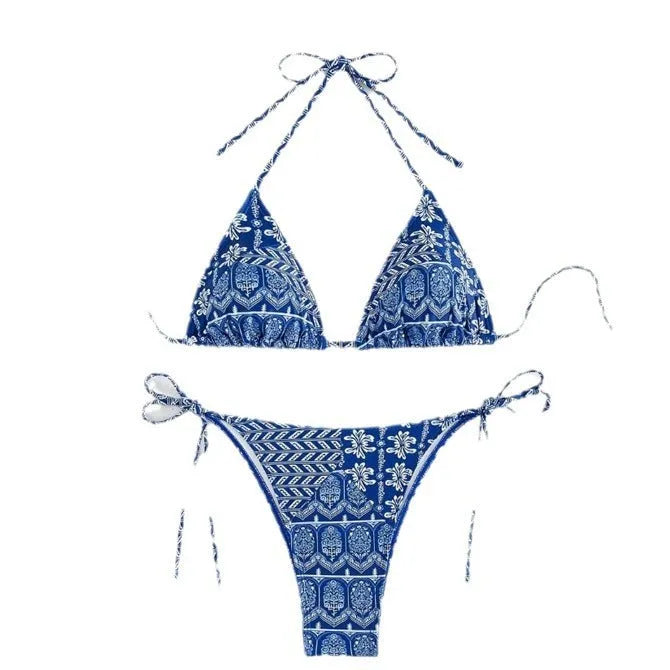 Women's green bandage-style split bikini swimsuit with stitching detail on a mannequin.