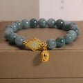 Sky blue natural stone bracelet with carved lotus and gourd pendant on electroplated brass setting