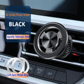 Silver magnetic phone holder attached to car air vent with phone mounted