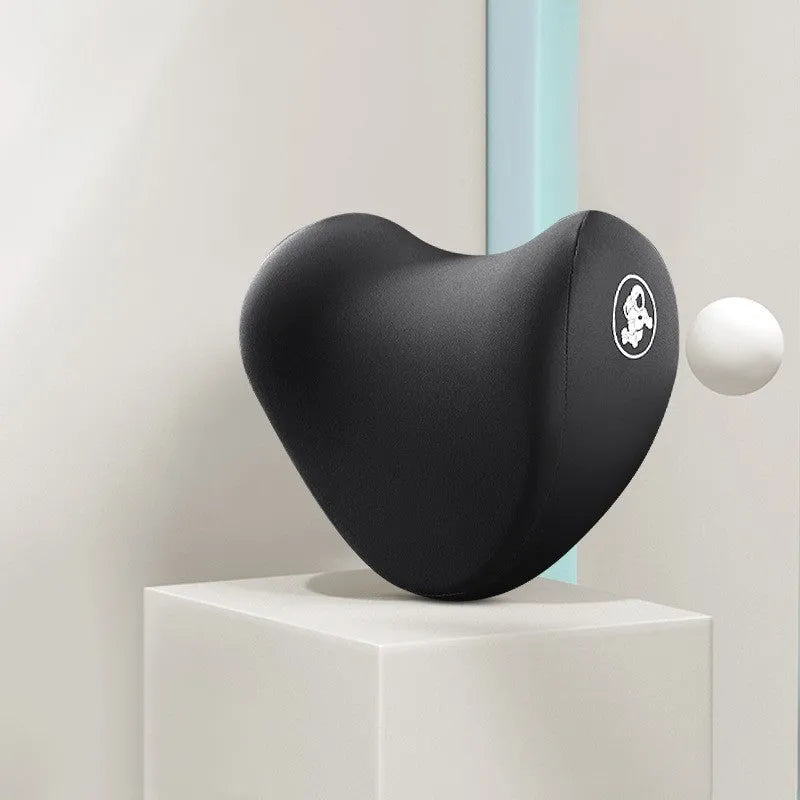 Heart-shaped black and grey car pillow set for headrest and lumbar support on a car seat.