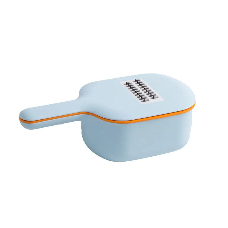 Dark blue vegetable cutter kitchen tool with hand guard, four stainless steel blades, and a white drain basket.